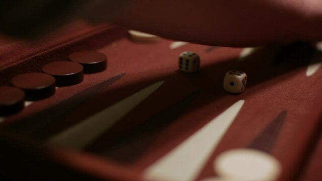backgammon board a player rolls a four one