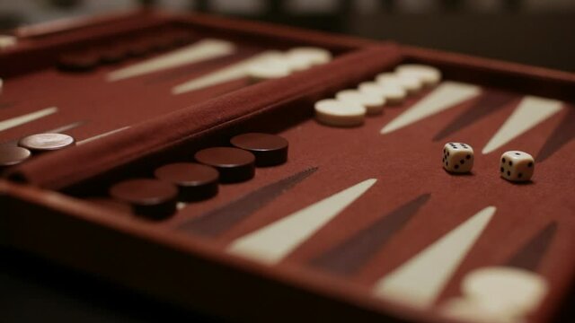 backgammon board at angle player rolls a six one