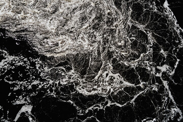 Waves of water in the river with whirlpool, aerial view. Water background. Abstract pattern of...