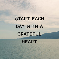 Inspirational motivating quote on background, "Start each day with a grateful heart"