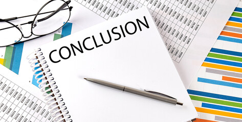 Notebook with text CONCLUSION . Diagram and white background
