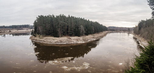 Beautiful river bend and forest on a winter day.