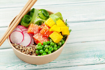 Poke bowl with salmon, cucumber and mango
