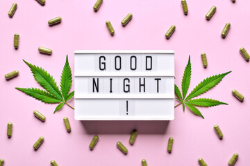 Cannabis extract capsules, hemp leaves and GOOD NIGHT letters lightbox. Calming, anti-stress and...