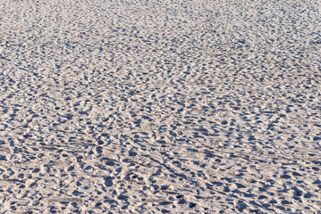 Clear texture of beige ripple sand.close up beach sand texture background.