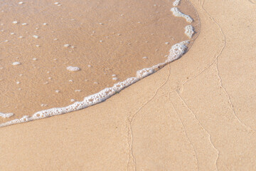 Soft wave of the sea on the sandy beach.Soft focus,blurred image.