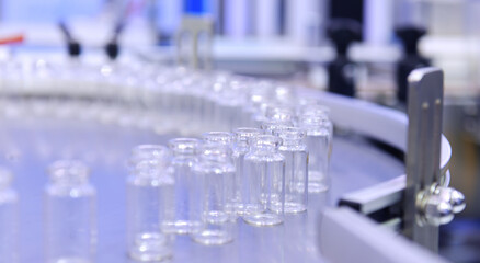 Clear glass bottles, vaccine vial transfer on automated conveyor systems automation for...