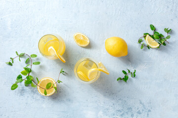 Lemonade. Homemade fresh drink with lemon and mint, overhead flat lay shot. Healthy citrus detox...