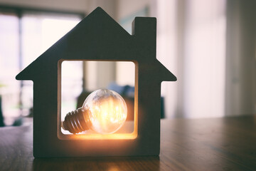 Wood house with Light bulb. energy concept or invention - obrazy, fototapety, plakaty