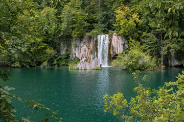 Fototapeta na wymiar Idyllic scenery of turquoise lakes, lush greenery and waterfalls.