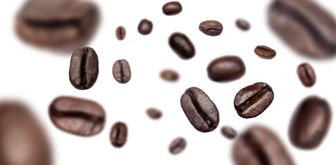 Brown roasted coffee beans flying on background.Represent energy  concept.