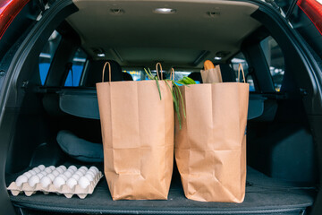 bags with products in car trunk