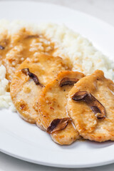 poultry meat with mushroom sauce and rice