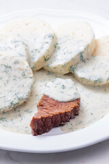beef meat with dill sauce and dumplings