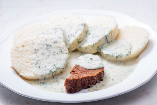 beef meat with dill sauce and dumplings