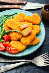 Nuggets with vegetable garnish