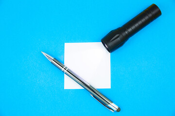 Blank white To Do List Sticker with flashlight and pen. Searching information on the Internet....