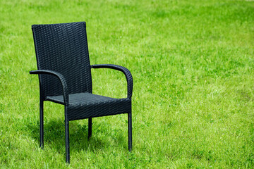 garden furniture, rattan chair on a green lawn . garden furniture   