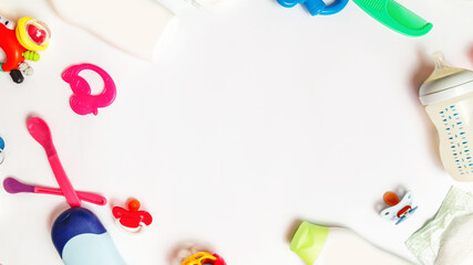 Baby care concept. Flat composition with baby clothes, and accessories on white background. copy space