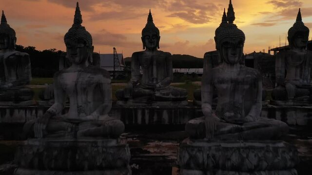 Aerial view image of Many Statue buddha image at sunset in southern of Thailand