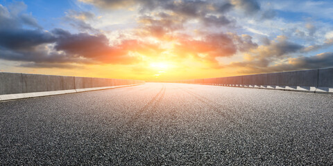 Asphalt highway and beautiful sky cloud scenery at sunset.