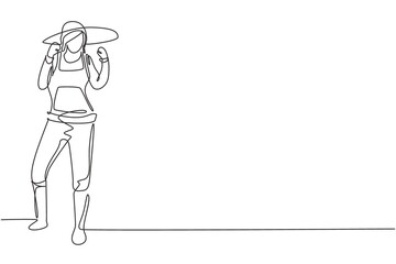 Continuous one line drawing female farmer stood with celebrate gesture, wearing straw hat and farm uniform to plant crops on farmland. Success work. Single line draw design vector graphic illustration