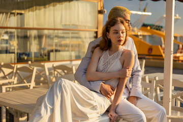 couple sitting on the table of street cafe