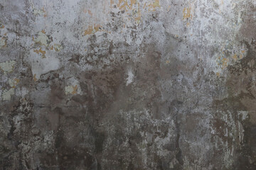 The texture of a worn out, old concrete wall.