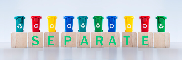 Recycling word letters on containers for metal, glass, paper, organics, plastic for further processing of garbage.