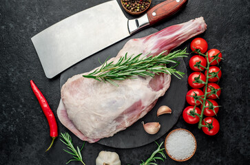  raw lamb shoulder blade with rosemary on stone background © александр таланцев