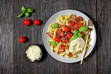 Pasta with bacon tomatoes and mozzarella, top view