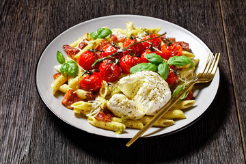 Pasta with bacon tomatoes and mozzarella, top view