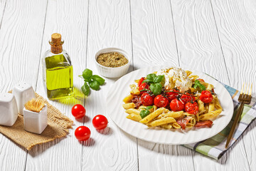 Pasta of penne, bacon, tomatoes, and mozzarella