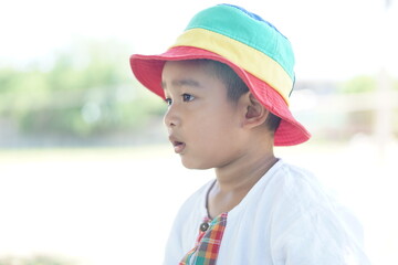 Cute Asian child little Thai boy 2 year old smile make a happy face concept. 