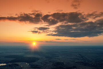 Sunset in the countryside in spring. Rural landscape in the evening. Aerial view of the countryside in evening. Panoramic view