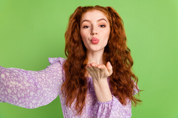 Photo of coquette ginger hairstyle millennial lady do selfie blow kiss wear violet blouse isolated...