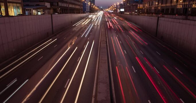Night traffic in the city on a highway. Moscow road lights