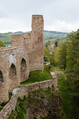Gothic medieval castle Velhartice in sunny day, tower and stone arch bridge, fortress masonry wall, old stronghold, Velhartice, National Park Sumava, South Bohemia, Czech Republic