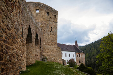 Fototapeta premium Gothic medieval castle Velhartice in sunny day, tower and stone arch bridge, fortress masonry wall, old stronghold, Velhartice, National Park Sumava, South Bohemia, Czech Republic