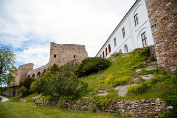 Obraz premium Gothic medieval castle Velhartice in sunny day, tower and stone arch bridge, fortress masonry wall, old stronghold, Velhartice, National Park Sumava, South Bohemia, Czech Republic