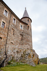 Fototapeta na wymiar Gothic medieval castle Velhartice in sunny day, tower at the hill near forest, fortress masonry wall, old stronghold, Velhartice, National Park Sumava, South Bohemia, Czech Republic