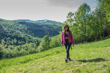 Fototapeta premium woman walking in the woods