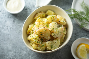 Traditional homemade potato salad with herbs