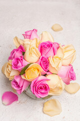 Bouquet of fresh multicolored roses in a vase