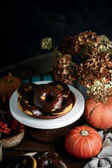 Obraz na płótnie Canvas Pumpkin donuts with nutella glaze.
