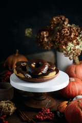 Obraz na płótnie Canvas Pumpkin donuts with nutella glaze.