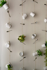 Mugs and spoons hanging on the wall design
