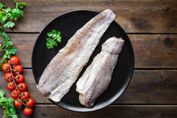hake fresh pangasius fish seafood ingredient on the table healthy food meal copy space food...