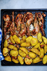 Roast rabbit with potato.top view ..style vintage