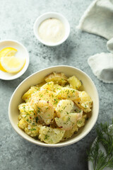 Traditional homemade potato salad with herbs